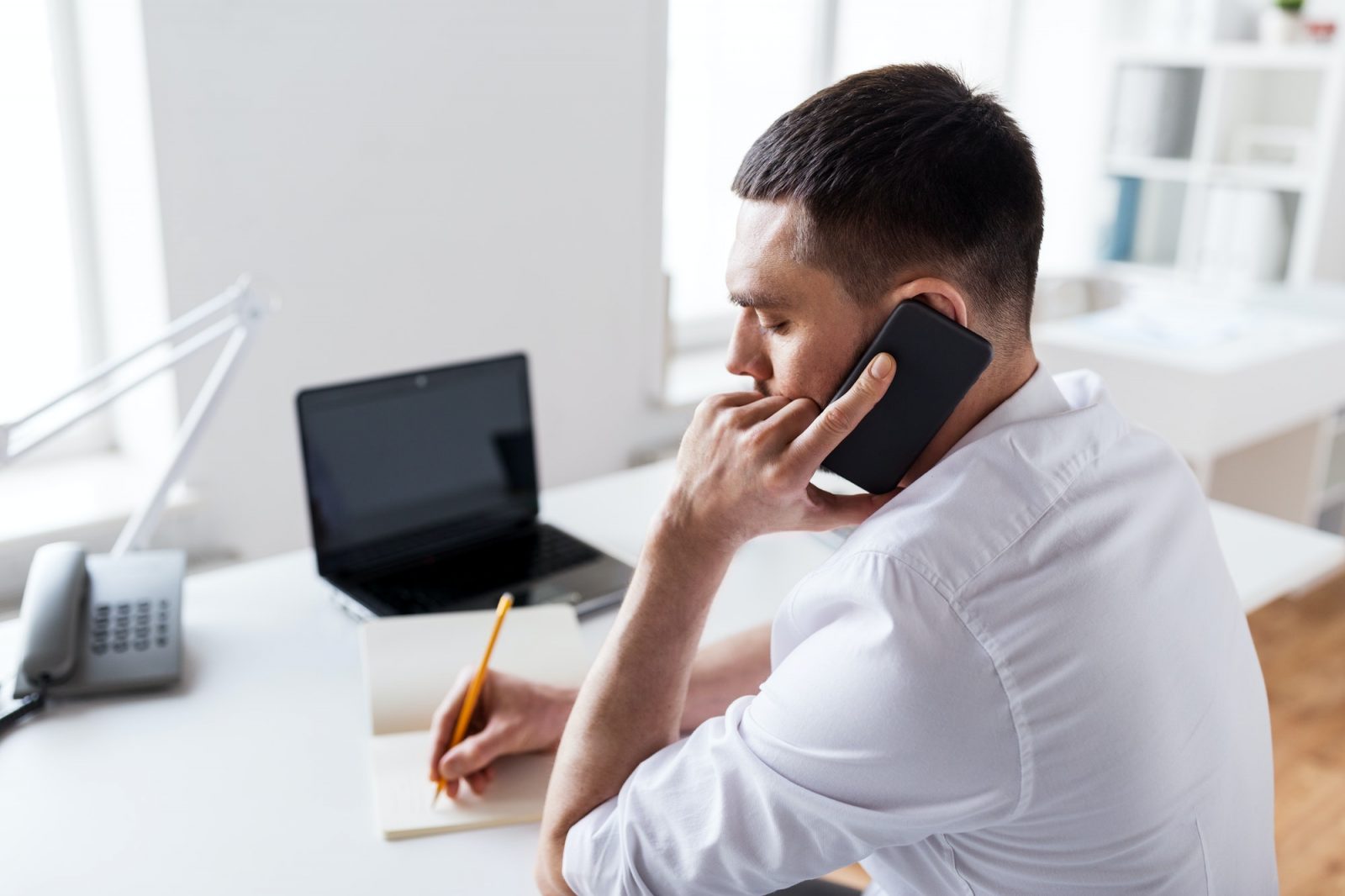 businessman calling on smartphone at office